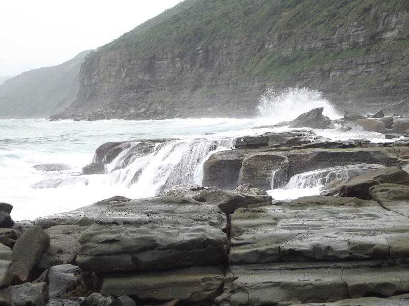 Waves breaking on rocks