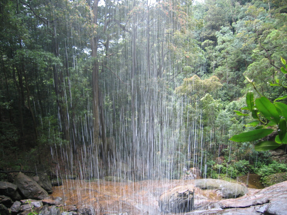 A view from behind one of the waterfalls